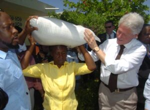 Bill Clinton shares in Haiti's failed earthquake recovery, Wyclef Jean next to them | Miami Herald